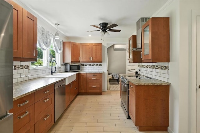 683 Rogers Ave, West Springfield, MA 01089 - kitchen with appliances with stainless steel finishes, a ceiling fan, tasteful backsplash, brown cabinets, and glass insert cabinets