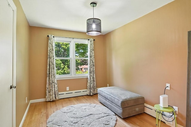 683 Rogers Ave, West Springfield, MA 01089 - living area featuring a baseboard heating unit and hardwood / wood-style floors