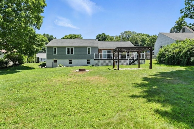683 Rogers Ave, West Springfield, MA 01089 - back of property with a lawn, a fire pit, a wooden deck, and a gazebo