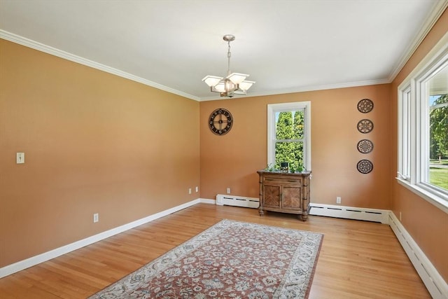 683 Rogers Ave, West Springfield, MA 01089 - spare room with a baseboard heating unit, a chandelier, wood finished floors, and ornamental molding
