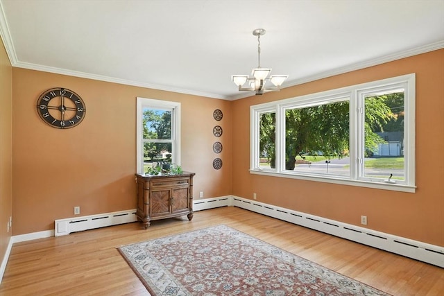683 Rogers Ave, West Springfield, MA 01089 - spare room with baseboard heating, a chandelier, wood finished floors, and ornamental molding
