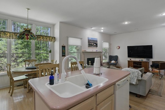 7 Alder Way Unit 7, Bedford, MA 01730 - kitchen with a sink, white dishwasher, a kitchen island with sink, light wood-type flooring, and open floor plan