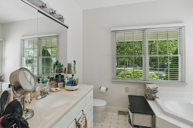 7 Alder Way Unit 7, Bedford, MA 01730 - bathroom with healthy amount of natural light, vanity, a garden tub, and baseboards