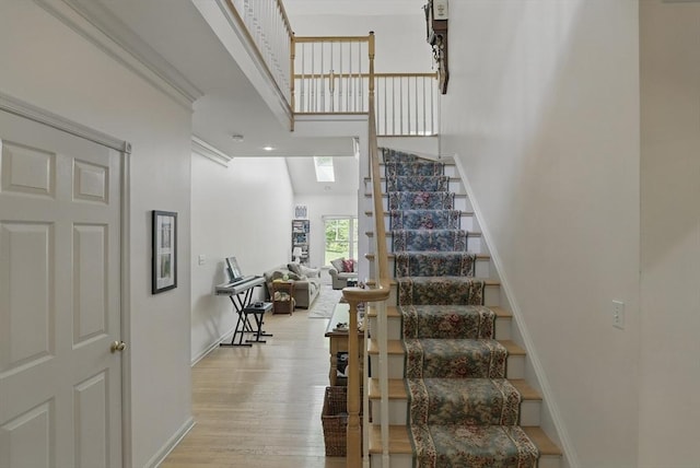 7 Alder Way Unit 7, Bedford, MA 01730 - stairs with wood finished floors, baseboards, and a towering ceiling