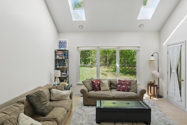 7 Alder Way Unit 7, Bedford, MA 01730 - living room featuring a skylight, light wood finished floors, and vaulted ceiling