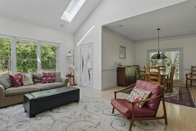 7 Alder Way Unit 7, Bedford, MA 01730 - living area with a skylight, light wood-type flooring, crown molding, and high vaulted ceiling