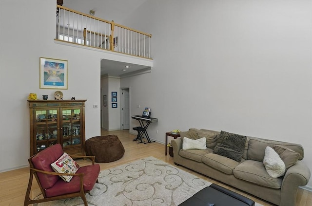 7 Alder Way Unit 7, Bedford, MA 01730 - living area featuring wood finished floors, a high ceiling, and baseboards