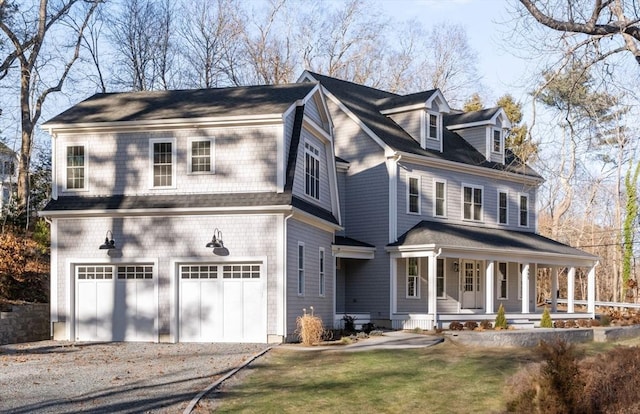 view of front facade with a porch and a garage