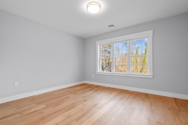 empty room with light wood-type flooring