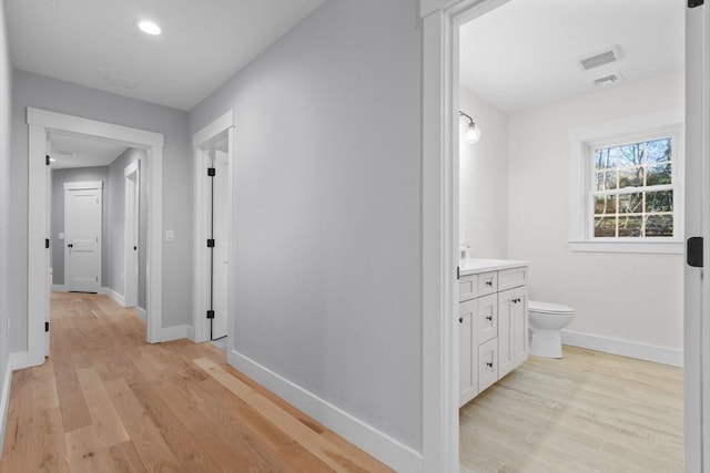 corridor featuring light hardwood / wood-style floors