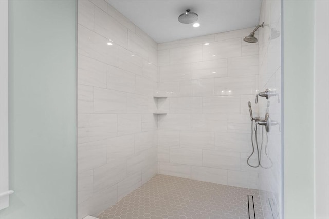 bathroom with tiled shower