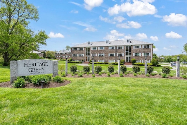 view of home's community featuring a yard