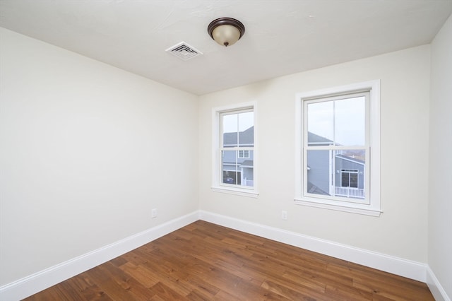 spare room featuring hardwood / wood-style flooring