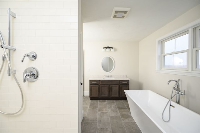 bathroom featuring plus walk in shower and vanity