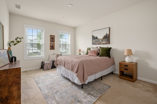 bedroom with light carpet