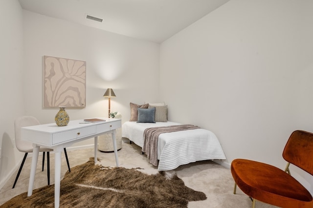 bedroom with vaulted ceiling and light colored carpet