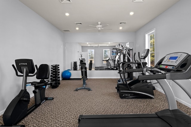 gym featuring ceiling fan and carpet flooring