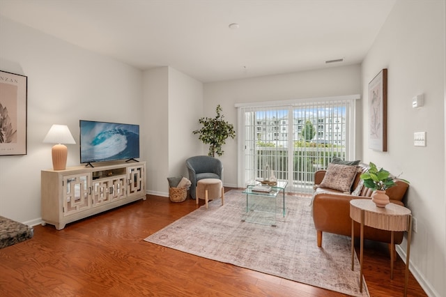 sitting room featuring hardwood / wood-style floors