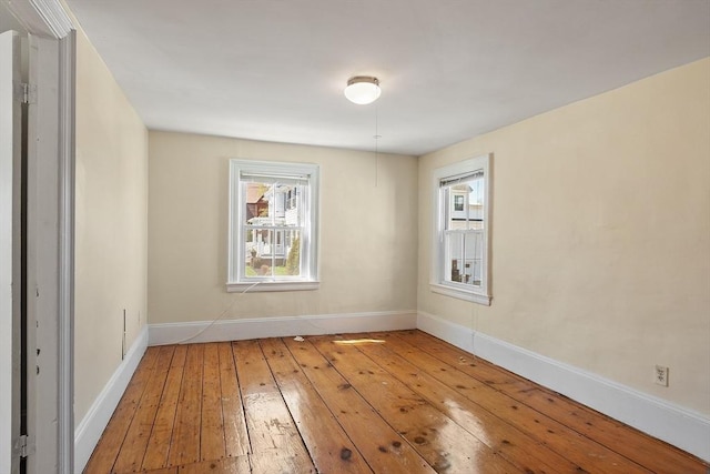 301 S Main, Haverhill, MA 01835 - unfurnished room featuring wood-type flooring, baseboards, and a healthy amount of sunlight