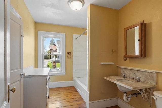 301 S Main, Haverhill, MA 01835 - bathroom featuring shower / bathtub combination, toilet, baseboards, and hardwood / wood-style flooring