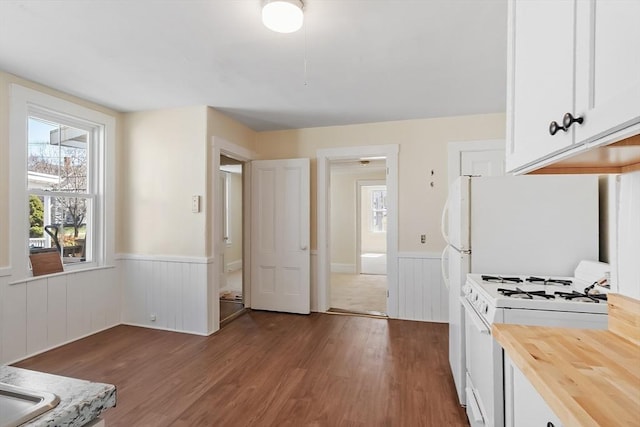 301 S Main, Haverhill, MA 01835 - kitchen featuring white cabinets, a wainscoted wall, wood finished floors, white range with gas cooktop, and butcher block counters
