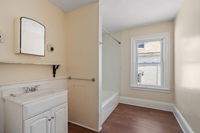 301 S Main, Haverhill, MA 01835 - bathroom featuring vanity, baseboards, wood finished floors, and tub / shower combination
