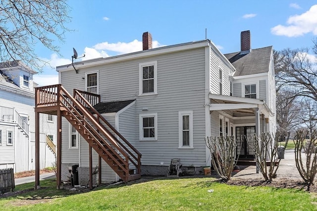 301 S Main, Haverhill, MA 01835 - rear view of property featuring a chimney, a lawn, a wooden deck, and stairway