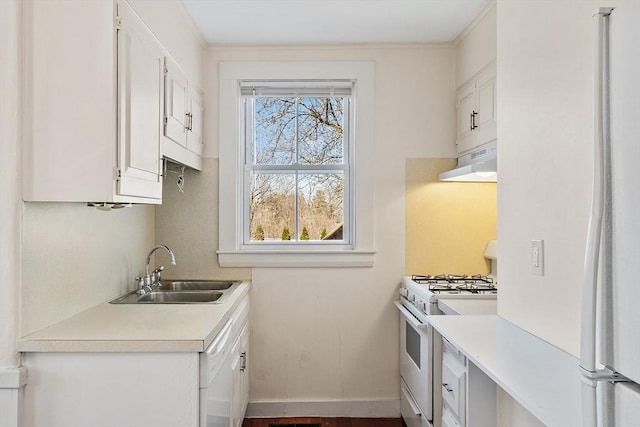 301 S Main, Haverhill, MA 01835 - kitchen featuring a sink, light countertops, under cabinet range hood, and white appliances