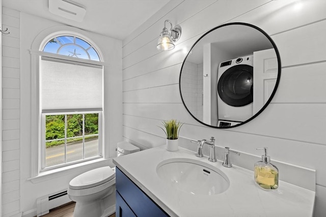 1137 Ferry St, Marshfield, MA 02050 - bathroom featuring a baseboard heating unit, vanity, toilet, and washer / clothes dryer