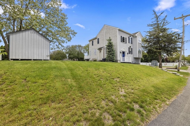 1137 Ferry St, Marshfield, MA 02050 - view of side of home featuring a yard and an outdoor structure