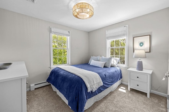 1137 Ferry St, Marshfield, MA 02050 - bedroom with a baseboard heating unit, multiple windows, and light colored carpet