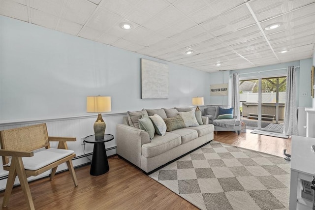 1137 Ferry St, Marshfield, MA 02050 - living area featuring wood finished floors, a wainscoted wall, and recessed lighting