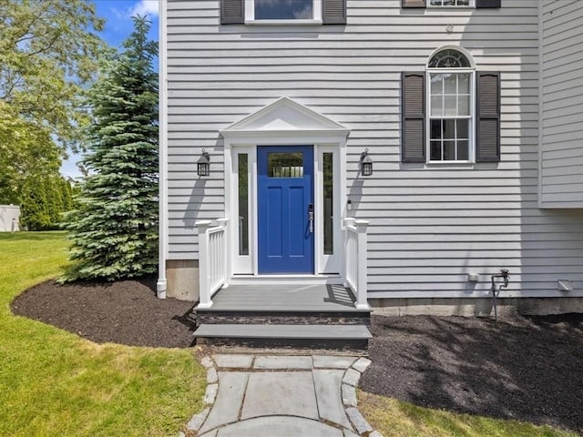 1137 Ferry St, Marshfield, MA 02050 - view of exterior entry featuring a yard