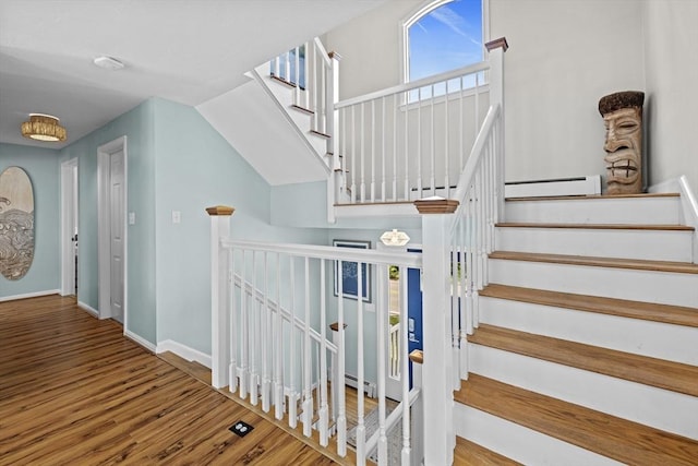 1137 Ferry St, Marshfield, MA 02050 - staircase featuring wood finished floors, baseboards, and baseboard heating