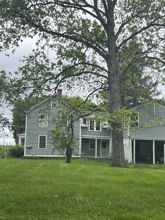 34 Old Bernardston Rd, Northfield, MA 01360 - back of house with a chimney and a lawn