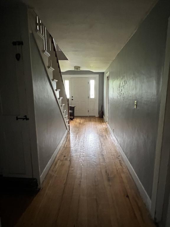 34 Old Bernardston Rd, Northfield, MA 01360 - corridor with stairs, light wood-type flooring, and baseboards