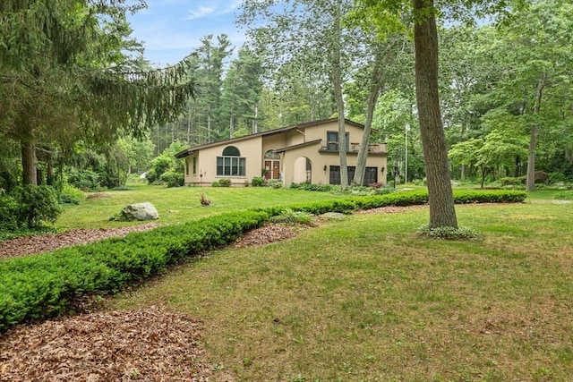 2 Orchard St, Berkley, MA 02779 - view of front of home with stucco siding and a front lawn