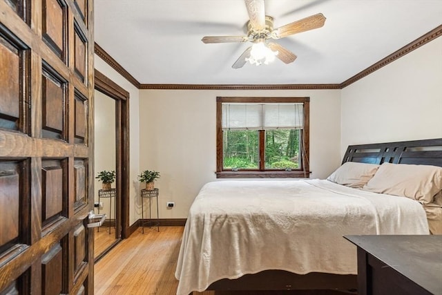 2 Orchard St, Berkley, MA 02779 - bedroom with light wood finished floors, crown molding, baseboards, and ceiling fan