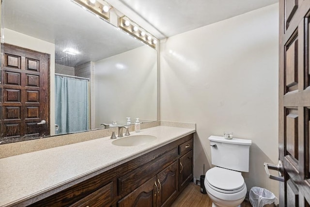 2 Orchard St, Berkley, MA 02779 - bathroom featuring toilet, vanity, wood finished floors, and curtained shower