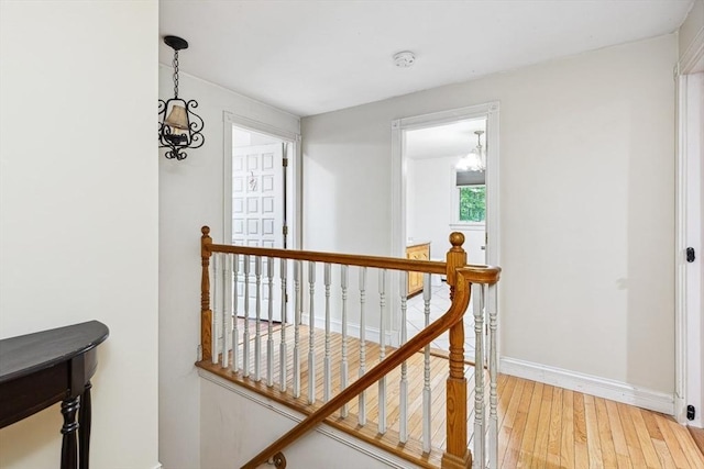 2 Orchard St, Berkley, MA 02779 - corridor featuring an upstairs landing, light wood-style floors, baseboards, and a chandelier