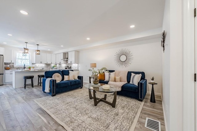 438 Granite St, Worcester, MA 01604 - living area with light wood-style flooring and recessed lighting