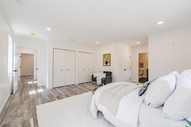 438 Granite St, Worcester, MA 01604 - bedroom with two closets, light wood-style floors, recessed lighting, and ensuite bath
