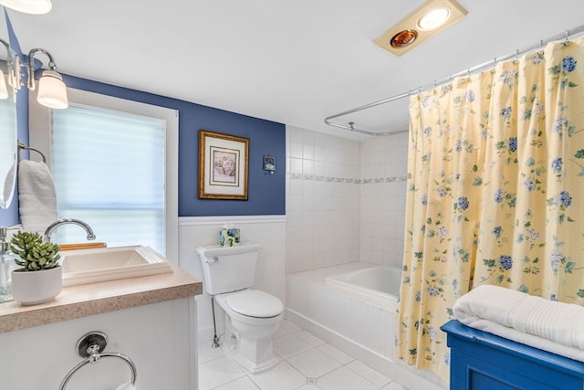 full bathroom featuring tile patterned flooring, vanity, toilet, and shower / bath combo