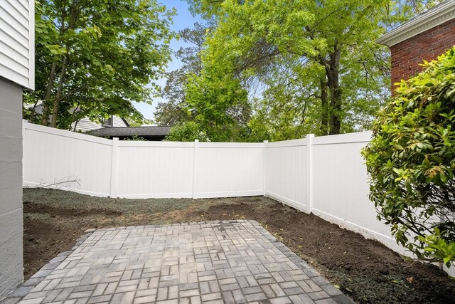 11 Bishop Rd Unit 11, Quincy, MA 02170 - fenced backyard featuring a patio area