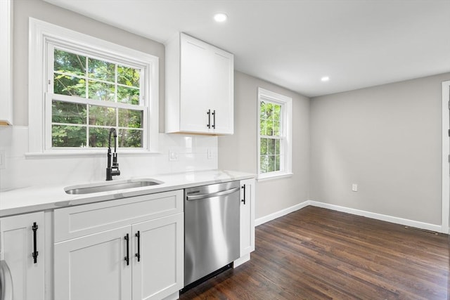 11 Bishop Rd Unit 11, Quincy, MA 02170 - kitchen featuring stainless steel dishwasher, a sink, baseboards, dark wood finished floors, and white cabinetry