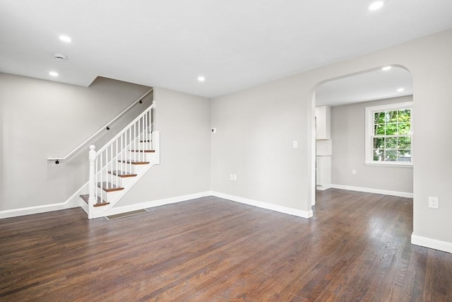 11 Bishop Rd Unit 11, Quincy, MA 02170 - spare room featuring arched walkways, wood finished floors, stairs, recessed lighting, and baseboards