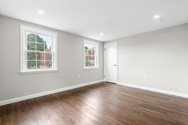 11 Bishop Rd Unit 11, Quincy, MA 02170 - empty room featuring dark wood-style flooring, baseboards, recessed lighting, and a smoke detector