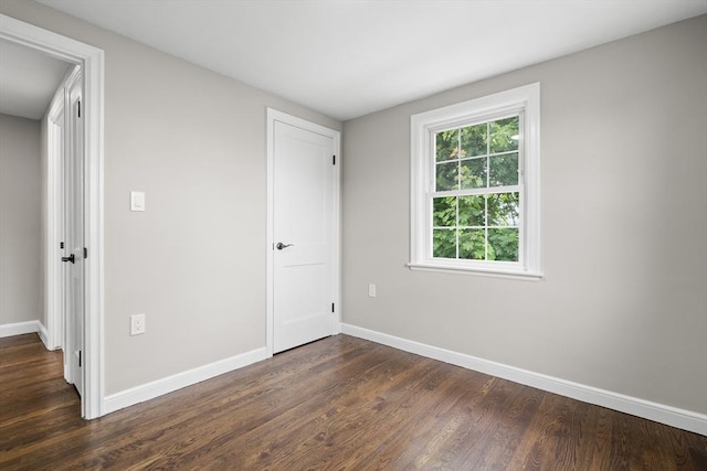 11 Bishop Rd Unit 11, Quincy, MA 02170 - unfurnished bedroom with dark wood-type flooring and baseboards
