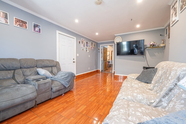 living room featuring wood-type flooring and ornamental molding