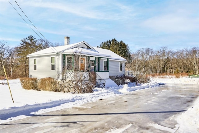 view of front of home featuring a chimney